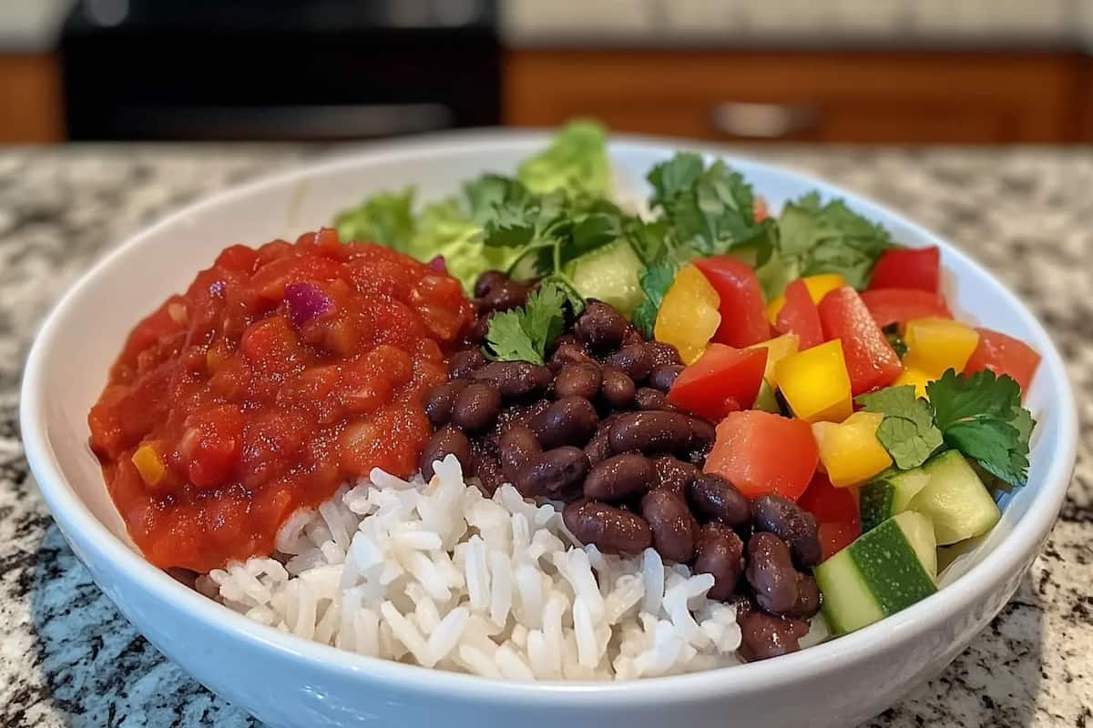 Chipotle bowl with black beans, rice, salsa, and vegetables